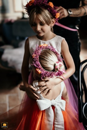 Palazzo Viviani, Rimini, Italy: A tender embrace between two flower girls having their garlands tied.